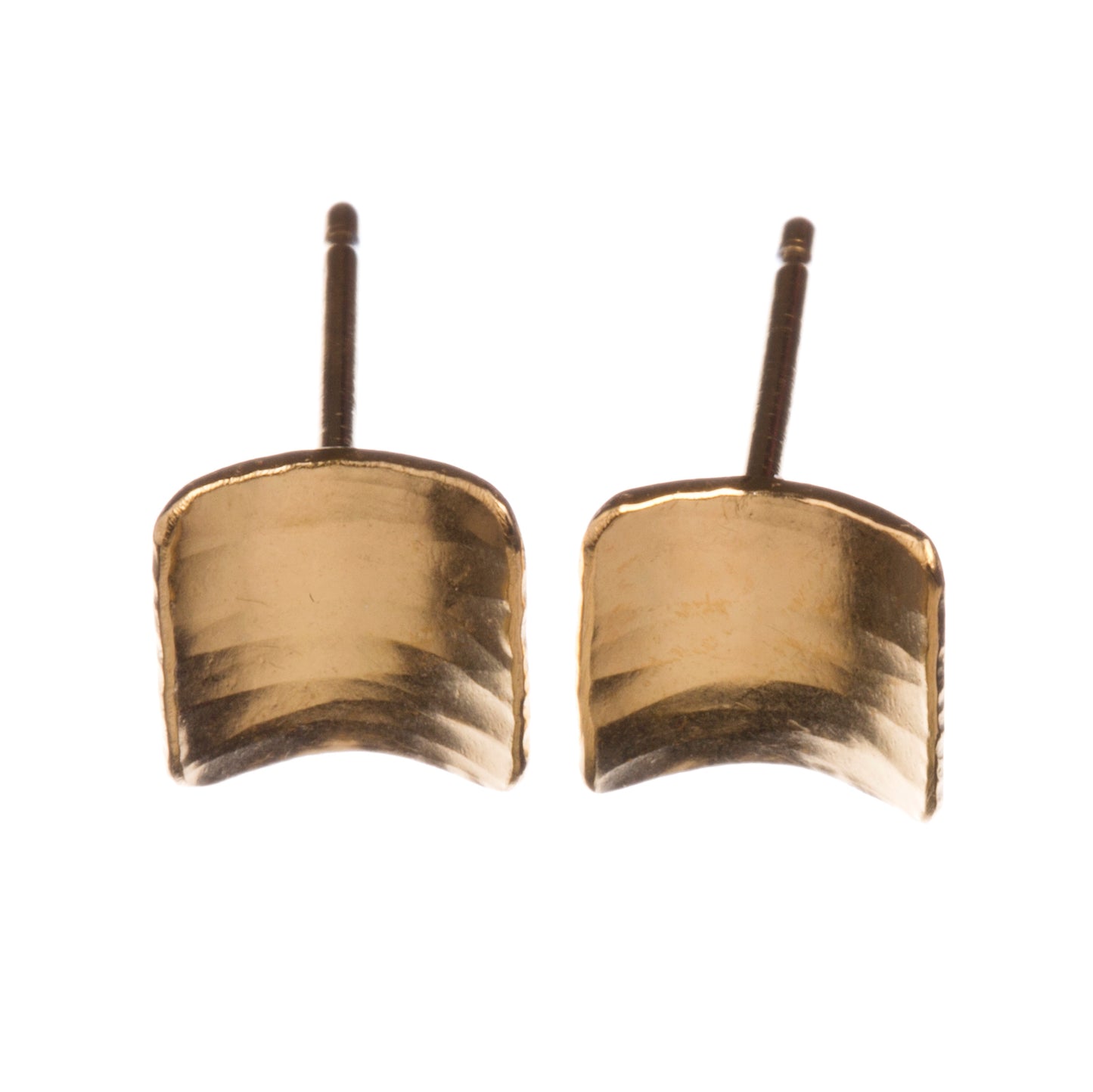 A pair of square silver earrings, studs, gold plated, with a subtle curve, a hammered texture and burnished edges.