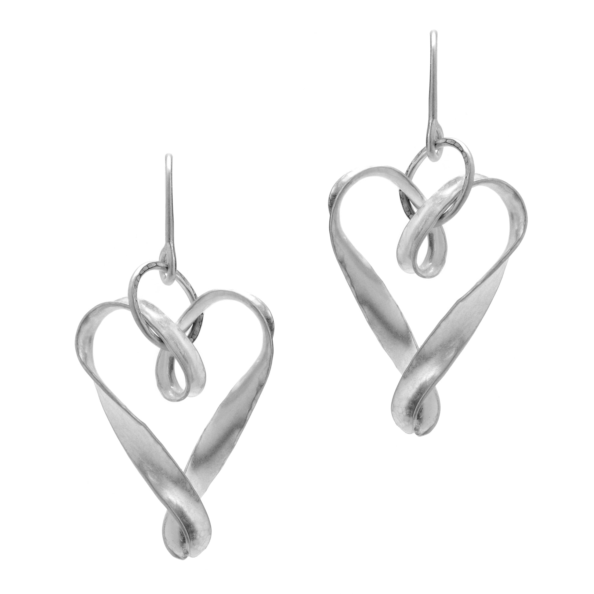 A pair of siver heart drop earrings, each formed from a single ribbon of metal, twisted and joined at the pointed end and hanging from an ear wire by a hammer textured large jump ring.
